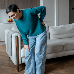 A service-connected knee injury leads to chronic back pain